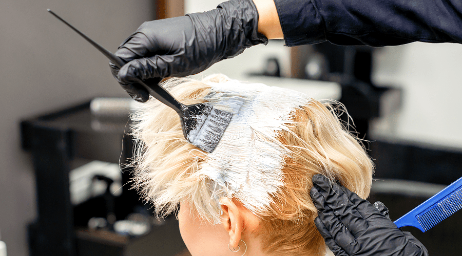 Professional hair coloring process in salon